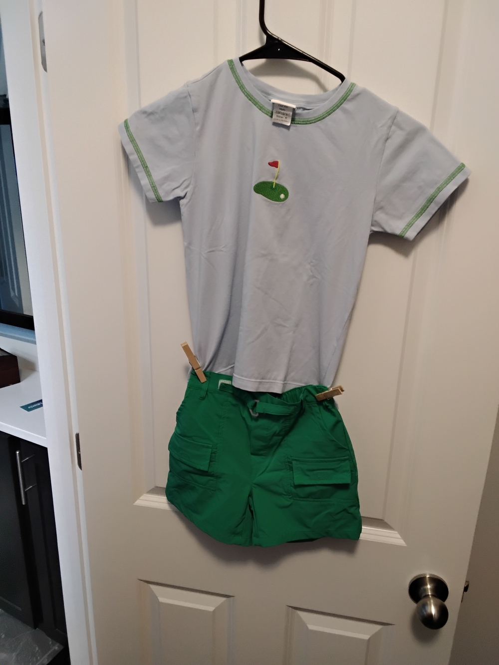 Kids Light Blue Golf Graphic Tee with Green Trim and Green Shorts